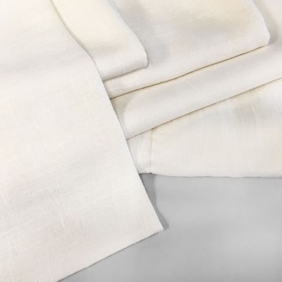 A stack of Donatas Modern, Eco friendly Linen Bath Towels in ivory