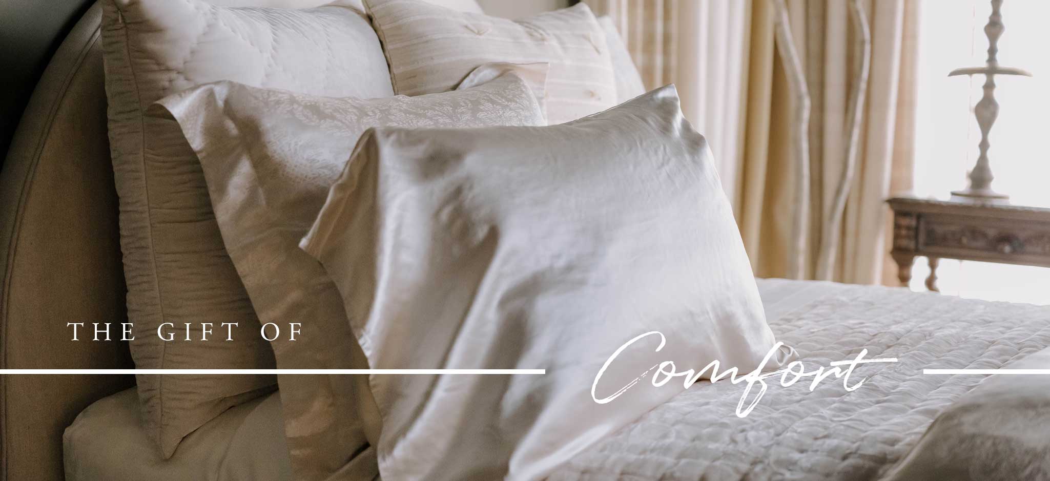 The Gift of Comfort — beautifully layered luxury bedding and soft textiles